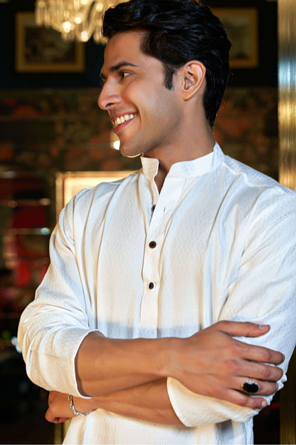 The White Long Kurta With Self Butti Work