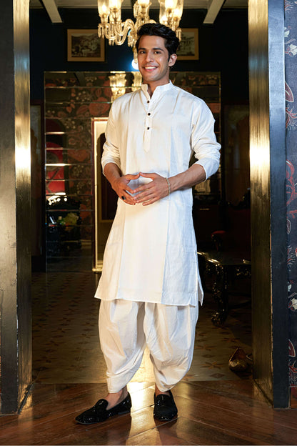 The White Long Kurta With Self Butti Work