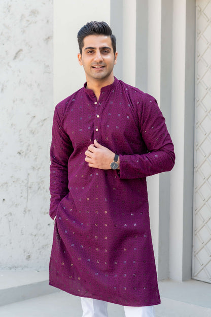 Indian man wearing wine color chikan kari kurta