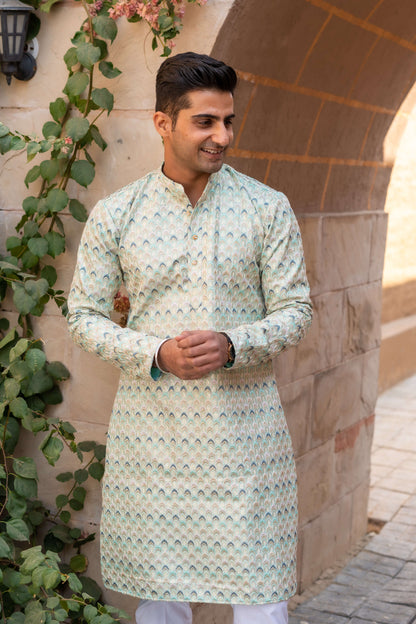 The Tribal Geometric Embroidery Work Long Kurta In Sea Green Color And Sequins Work