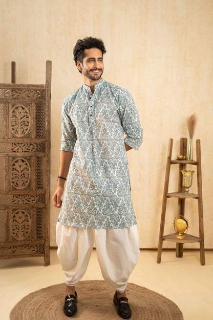  A man in a blue and white kurta, representing a blend of tradition and contemporary fashion.