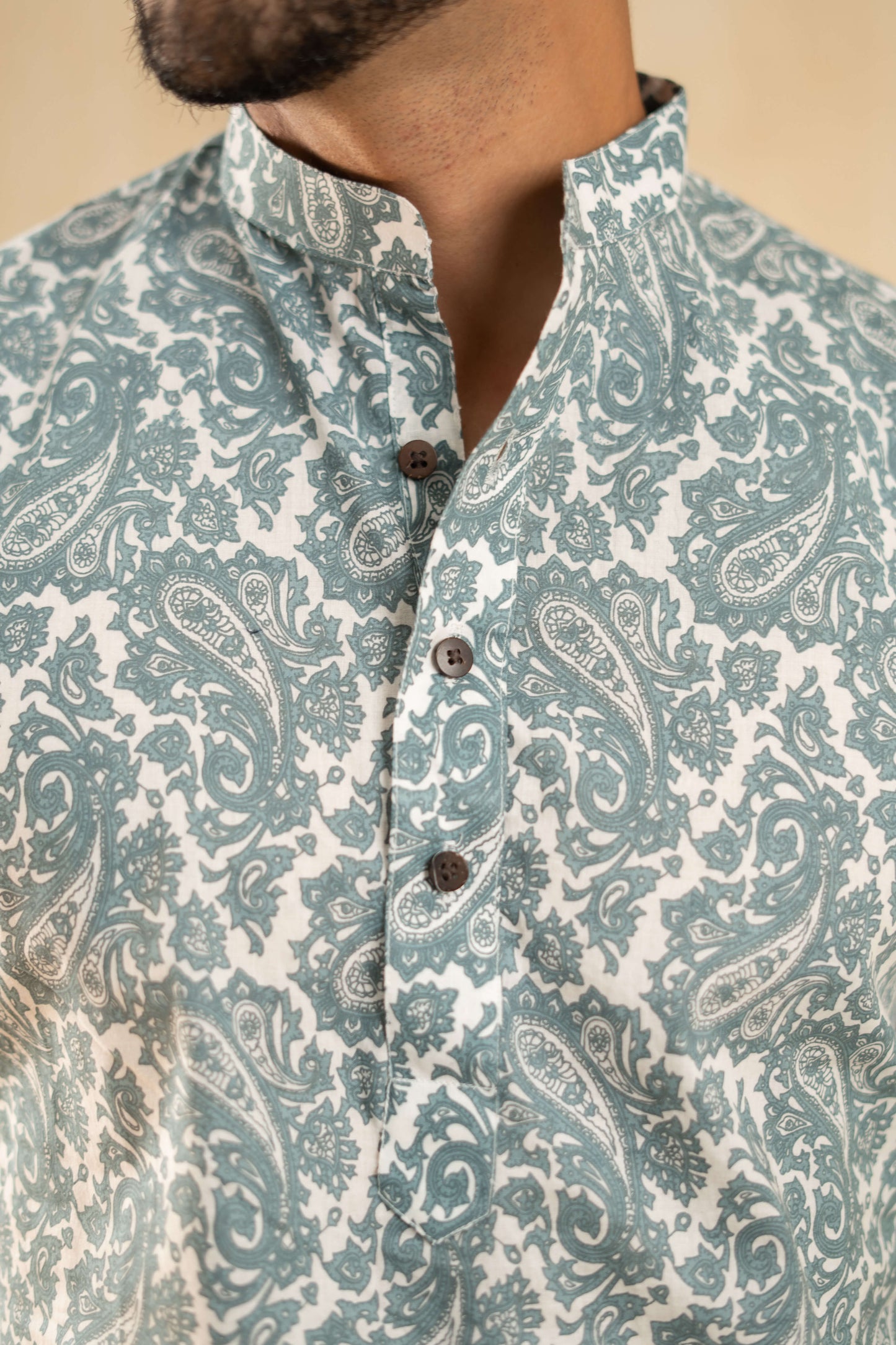  an Indian man in a blue and white kurta, representing a blend of tradition and contemporary fashion.