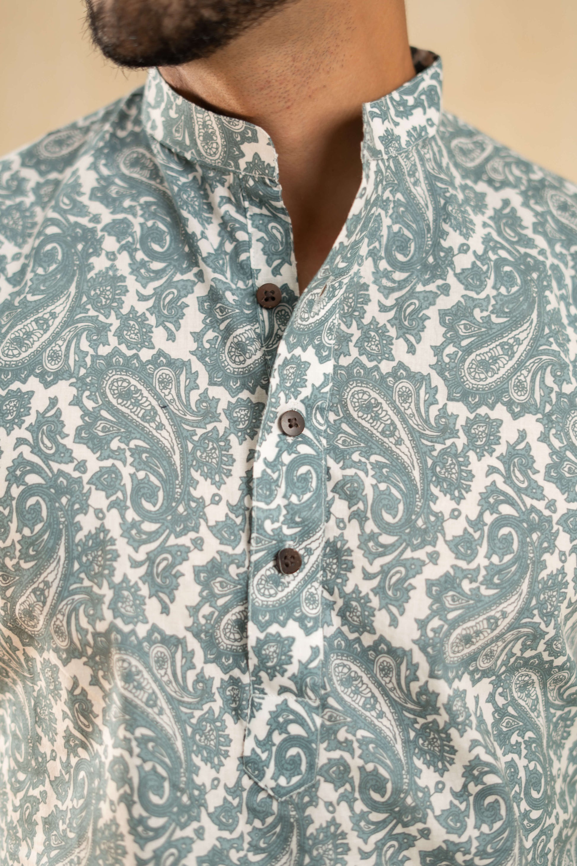  an Indian man in a blue and white kurta, representing a blend of tradition and contemporary fashion.