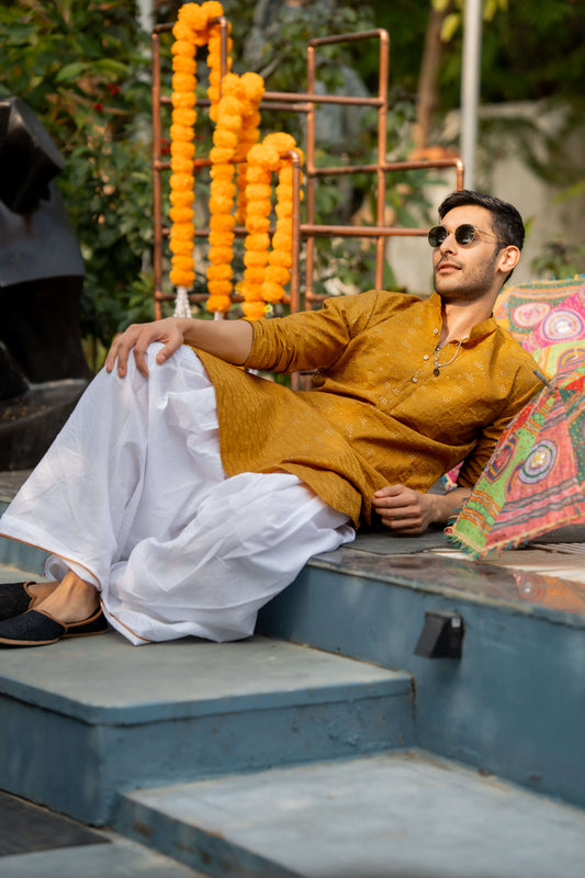 indian man wearing a yellow color kurta perfect for haldi function