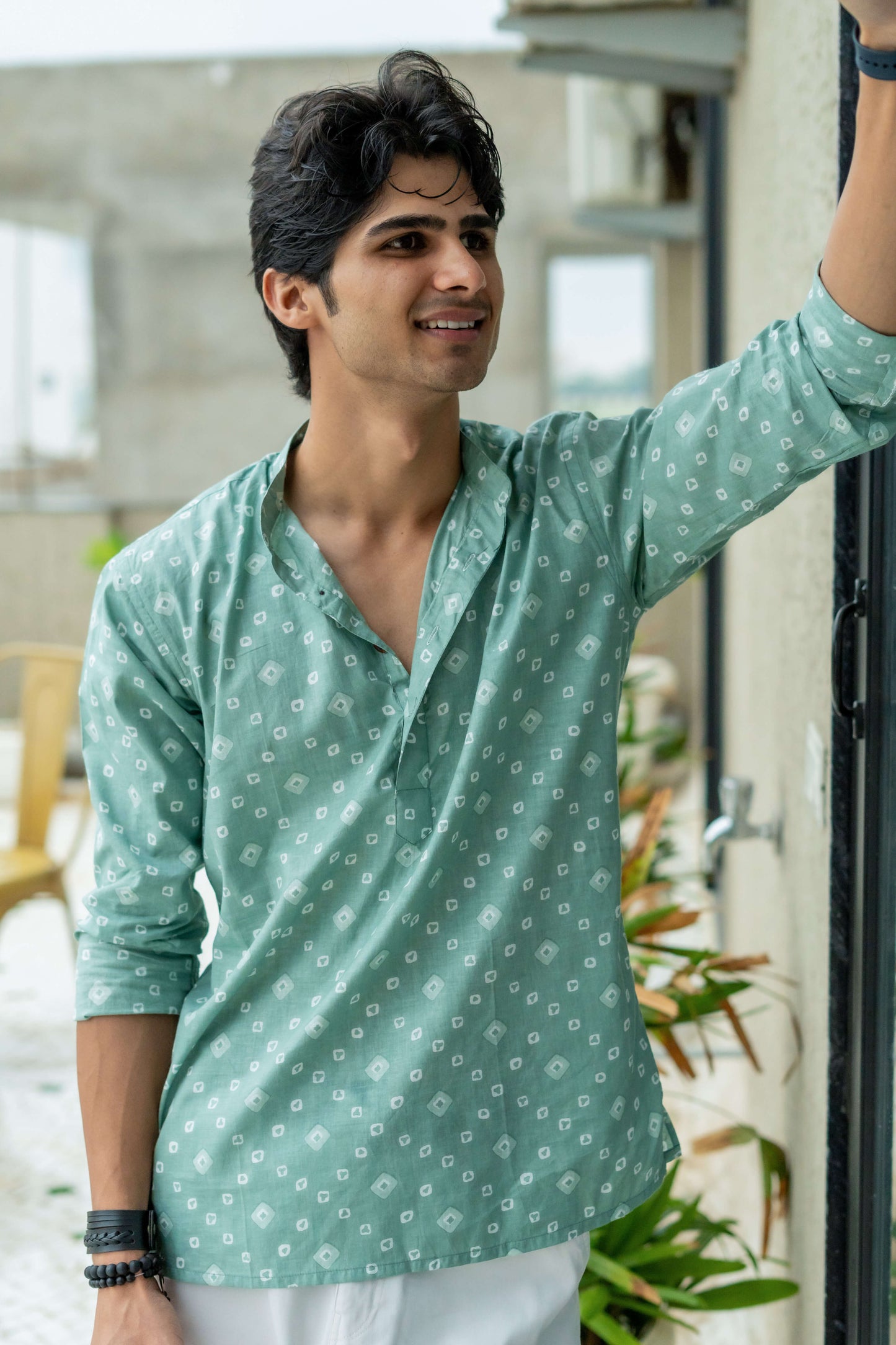 The Aquamarine Color Short Kurta With Geometric Print.