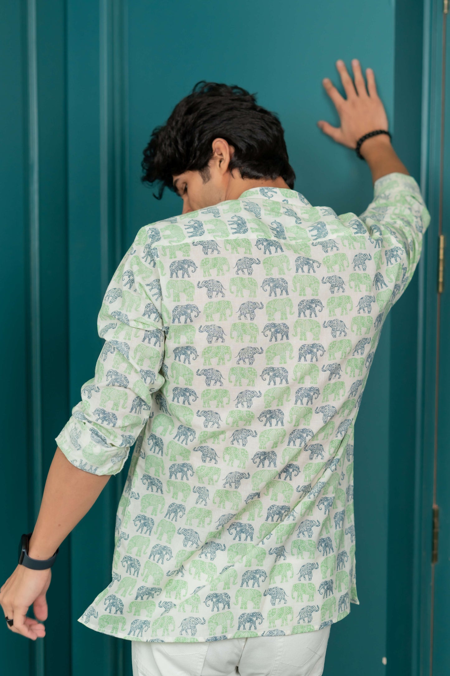 The White Short Kurta With Blue and Green Elephant Print.