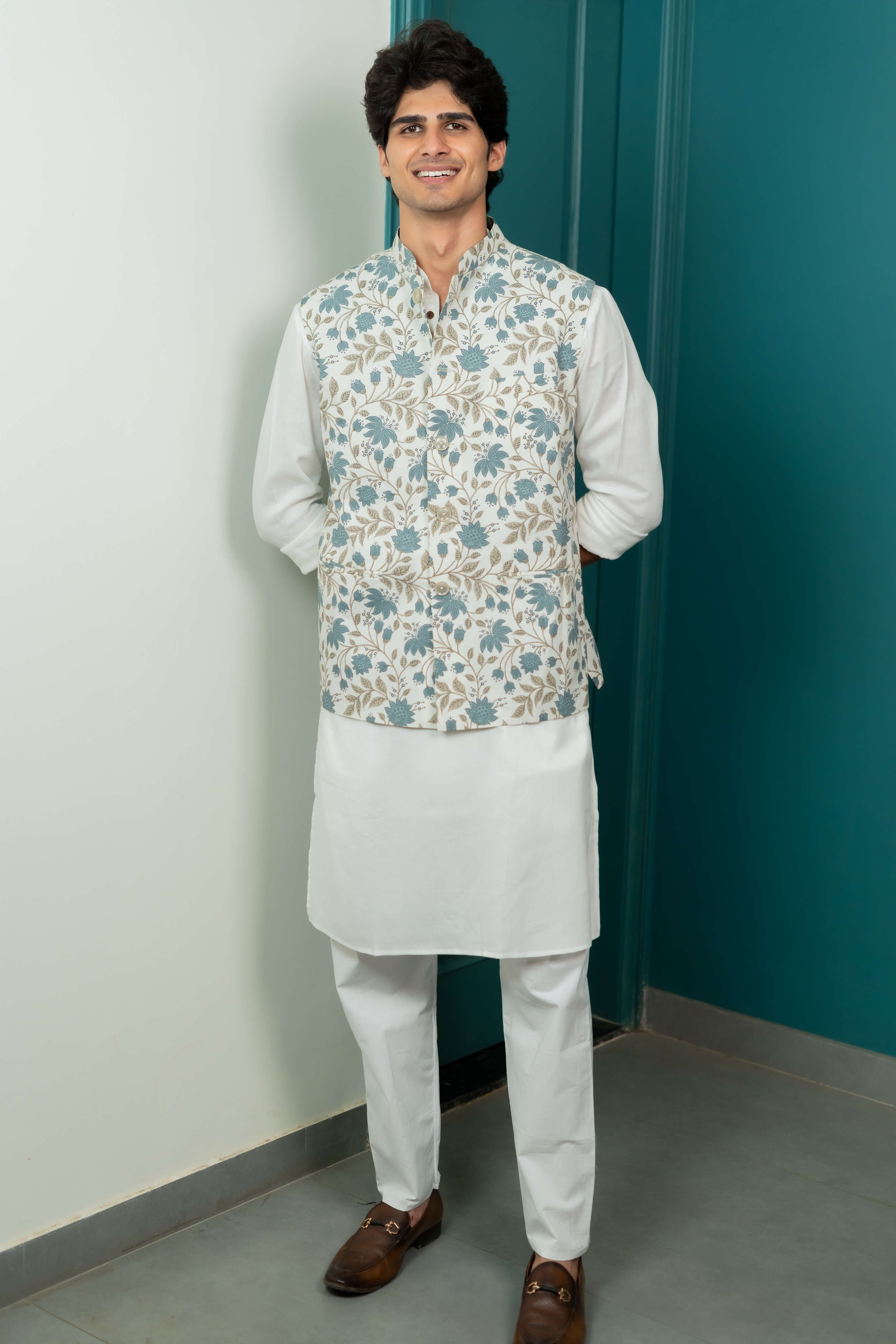 The White Nehru Jacket With All Over Floral Print Shasak