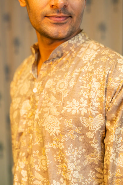 An Indian Man Wearing a Brown Color Long Kurta For Men With Off-White Floral Print Giving a Close-Up Look