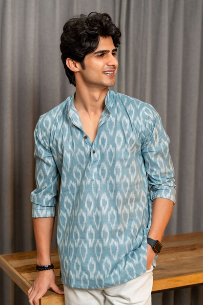 indian man in blue color short kurta featuring ikat print. 