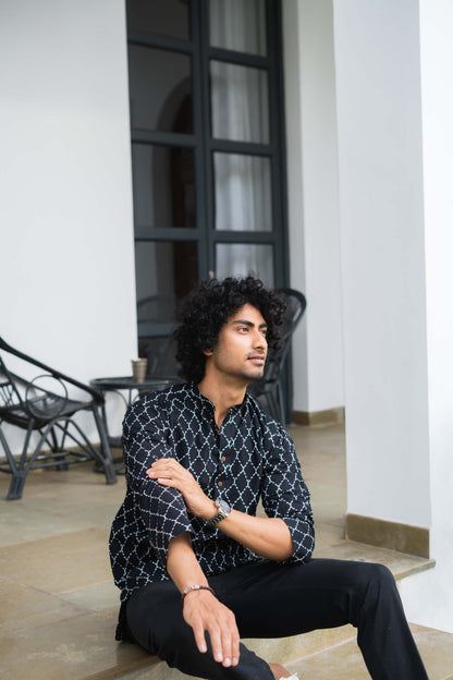 Indian man in black short kurta